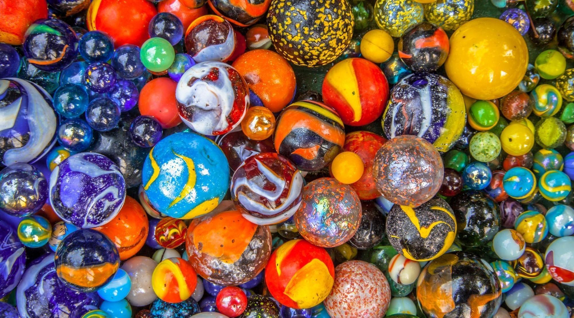 A photo of many different coloured marbles