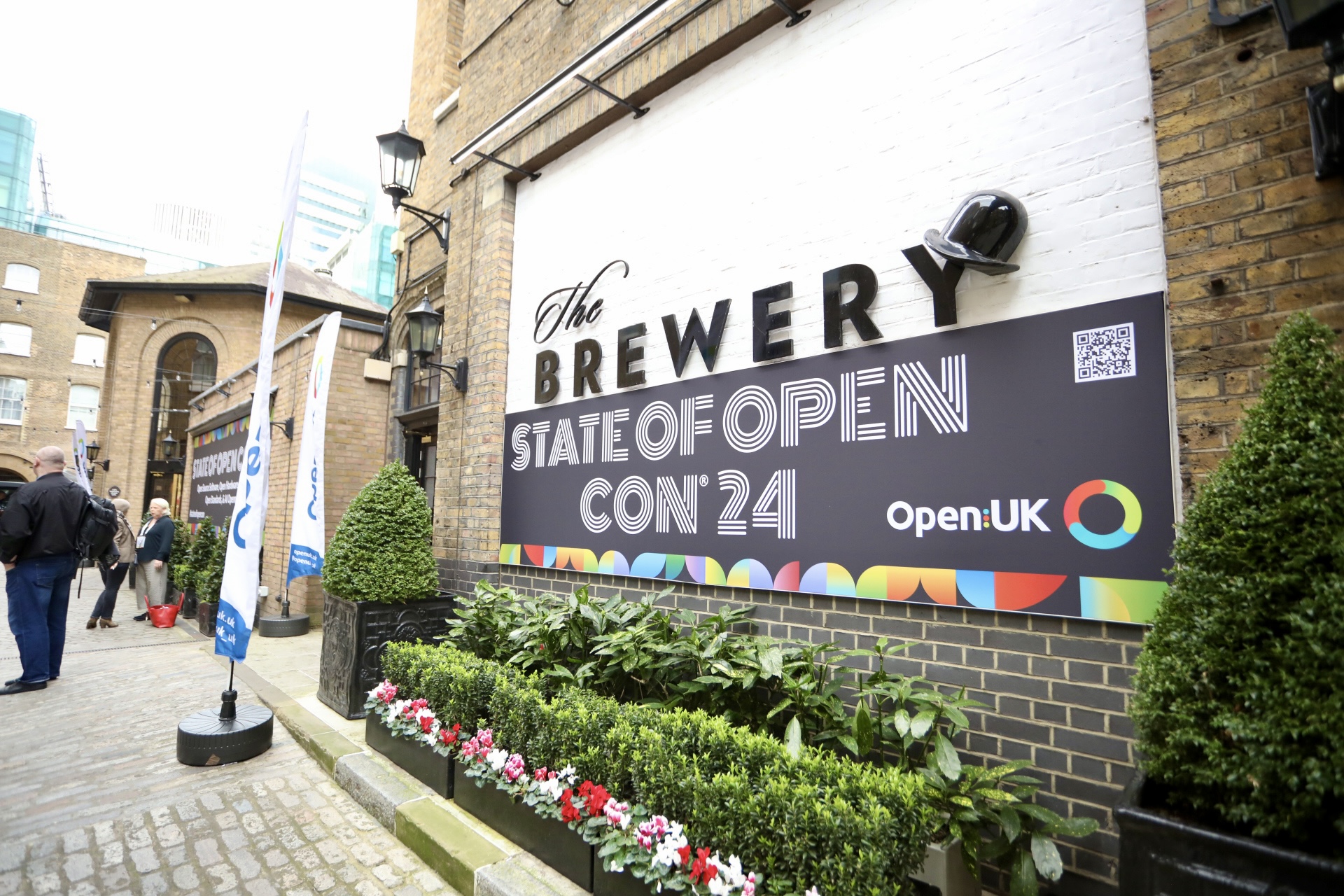A photo of the State of Open Con banner at The Brewery